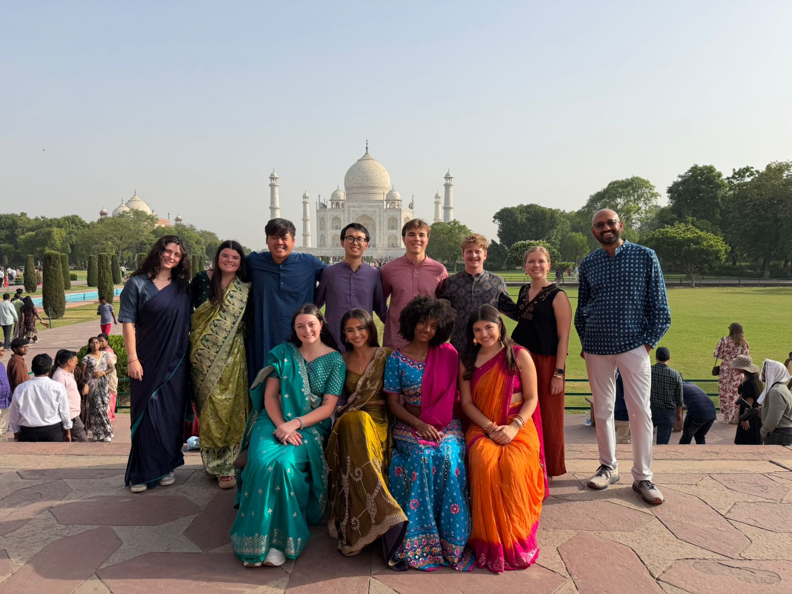 Terry students dressed in saris and kurta pajama in front of the Taj Mahal Study Abroad in India
