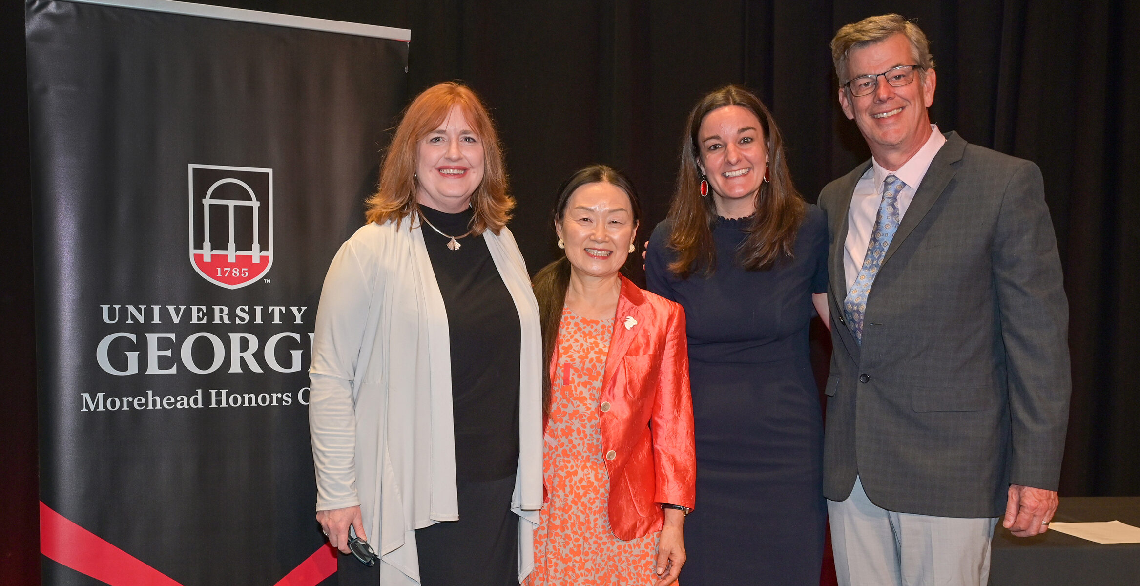 Meg Amstutz, left, dean of the Morehead Honors College, recognized Hyangsoon Yi, Erin Towery and Michael Terns for their contributions to Honors education.