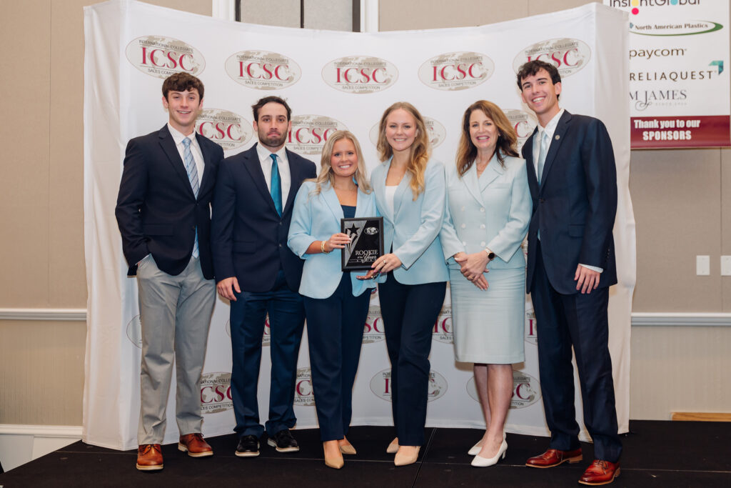 From left, Josh Krebs, Connor Johnson, Lauren Turner, Charlie Pansing, Cindy Rippe and Jordan Davis accept a rookie team of the year award at the International Collegiate Sales Competition.