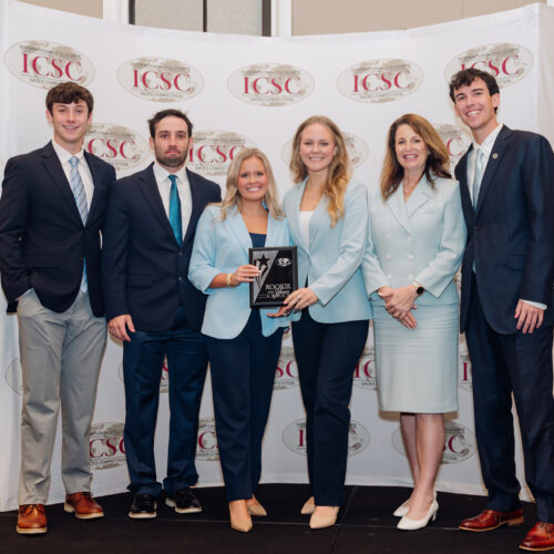 From left, Josh Krebs, Connor Johnson, Lauren Turner, Charlie Pansing, Cindy Rippe and Jordan Davis accept a rookie team of the year award at the International Collegiate Sales Competition.