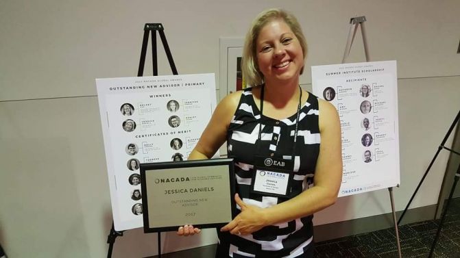 Jessica Daniels holding award