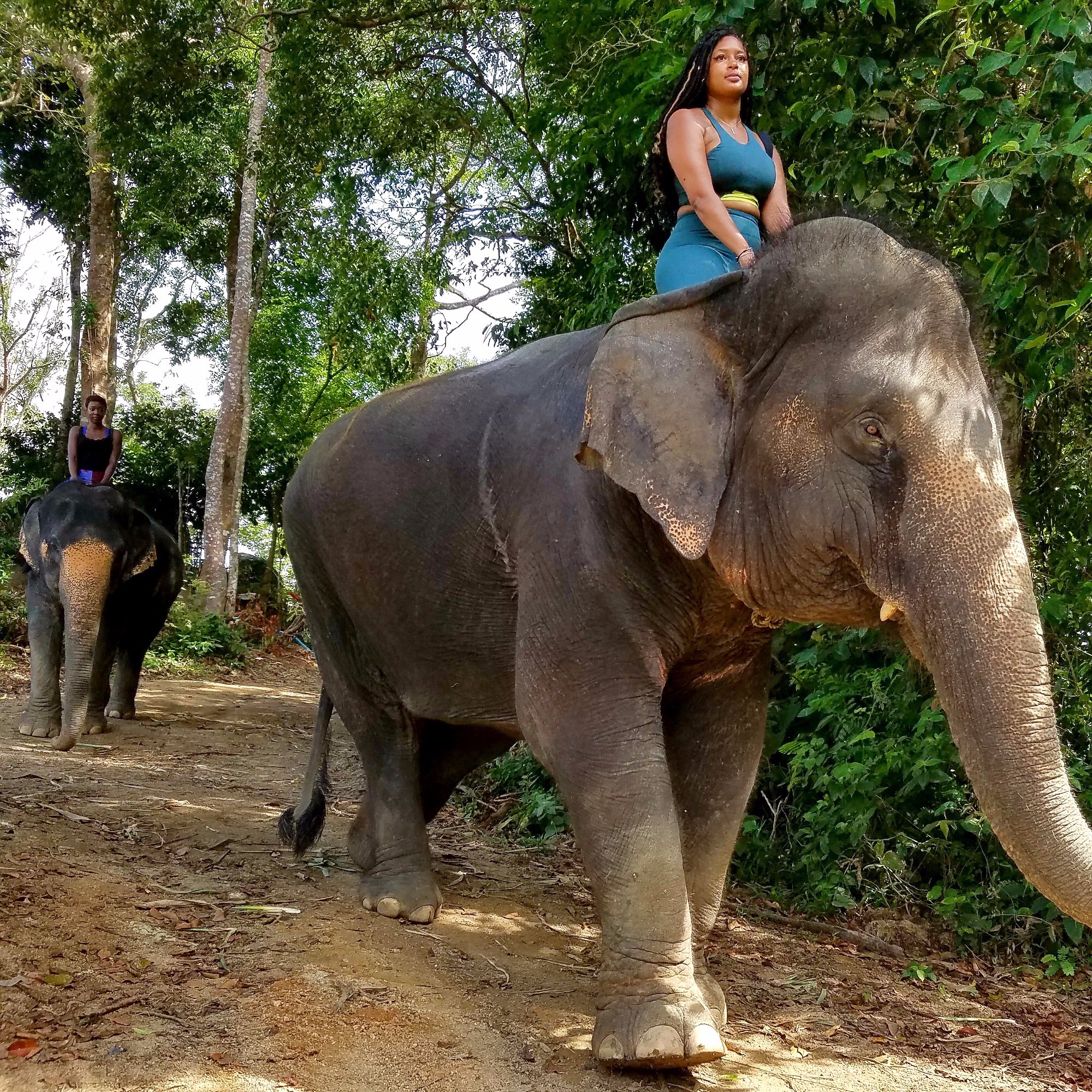 Kiara Morris sits on top of an elephant during a visit to Thailand.