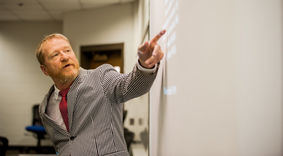 Terry College lecturer David Lowery leads a lecture during one of this classes.