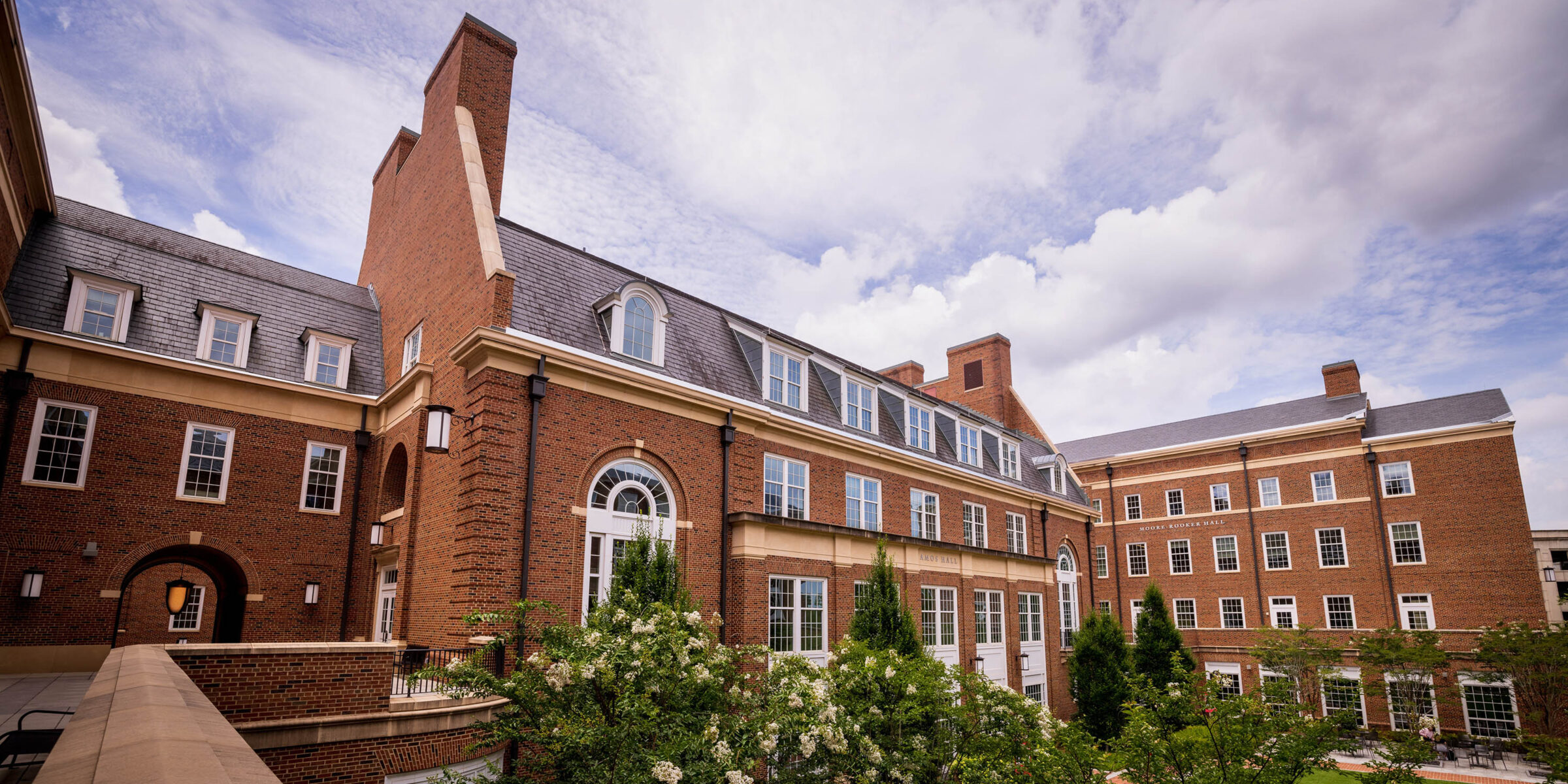 An outdoor photo of the Business Learning Community during a cloudy day.