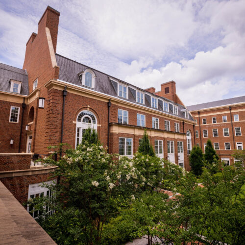 An outdoor photo of the Business Learning Community during a cloudy day.