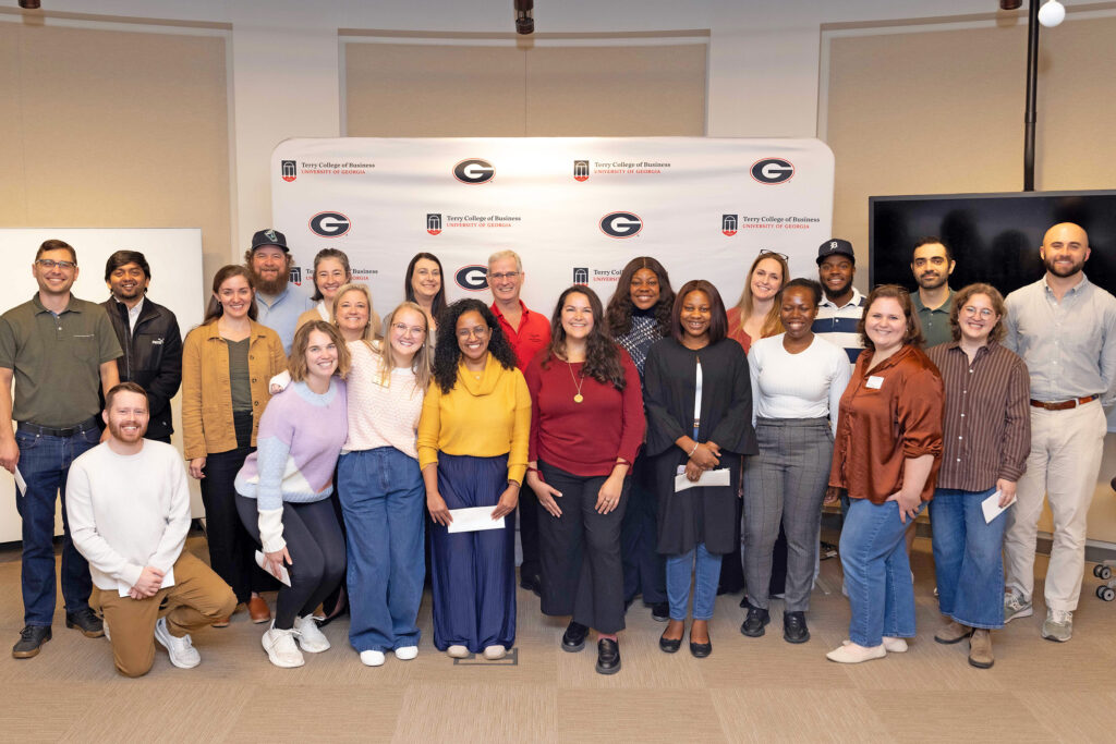 A group of MBA students and nonprofit leaders crowd into a group picture at the inaugural Georgia MBA Nonprofit Board Fellows Match Day.