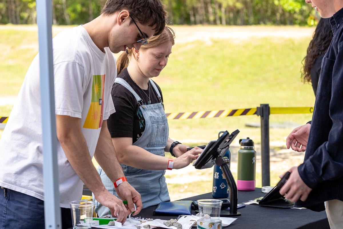 Students taking tickets at the Terry Music Business Beats and Brews Festival