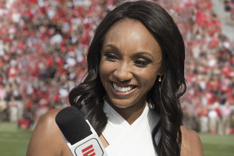 ESPN's Maria Taylor provides reporting during a college football game.