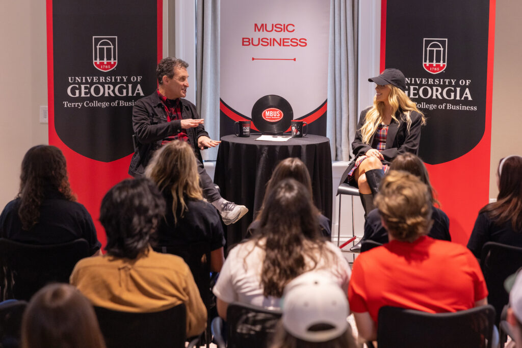 Megan Moroney talks to David Barbe in front of a crowd of UGA students in the Steling Study.