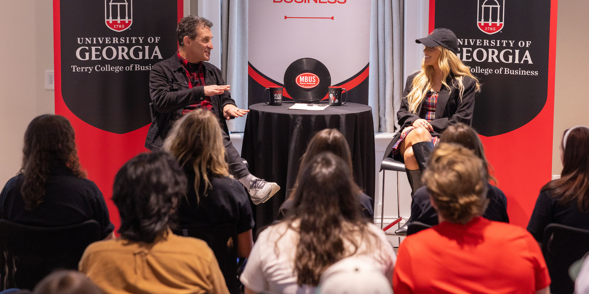 Megan Moroney talks to David Barbe in front of a crowd of UGA students in the Steling Study.