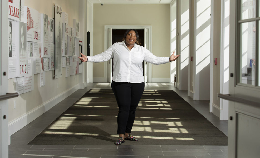 Terry College student Mikayla Coverson poses for a photo in a Business Learning Community hallway.