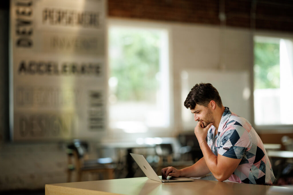 OMBT_V1 Student works at a computer.