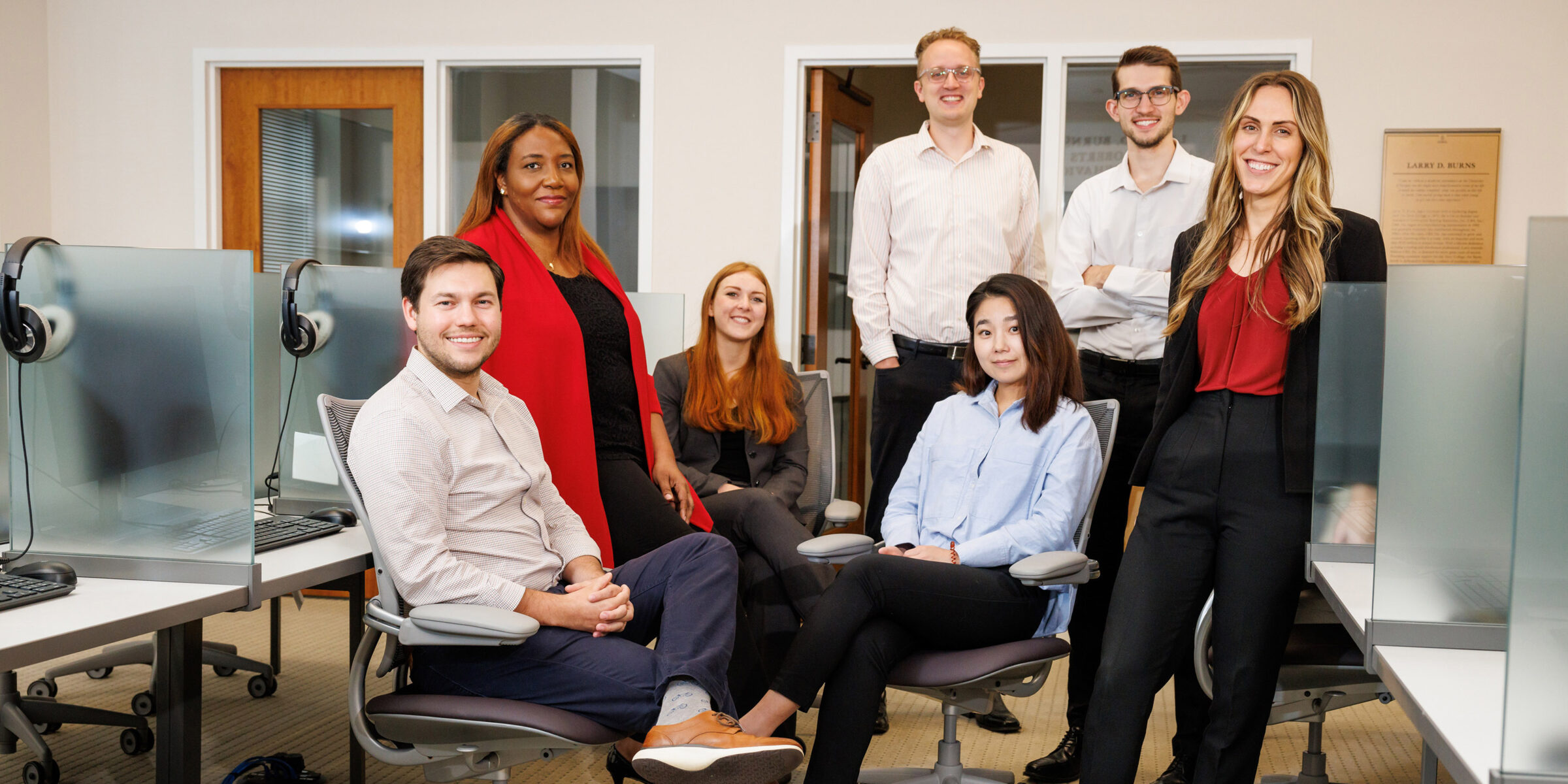 People posing for a photo in an office