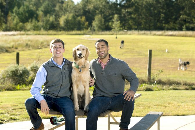 Tommy Naranjo (left) and Preston Tucker (right) pose with Gizmo the dog. Naranjo and Tucker created PuppyFax LLC