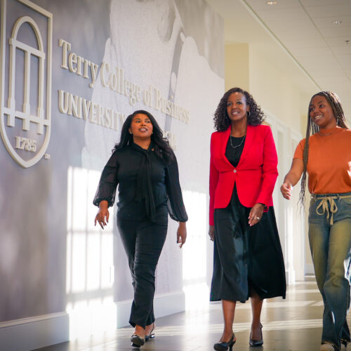 Rachel walks through the BLC with two mentees