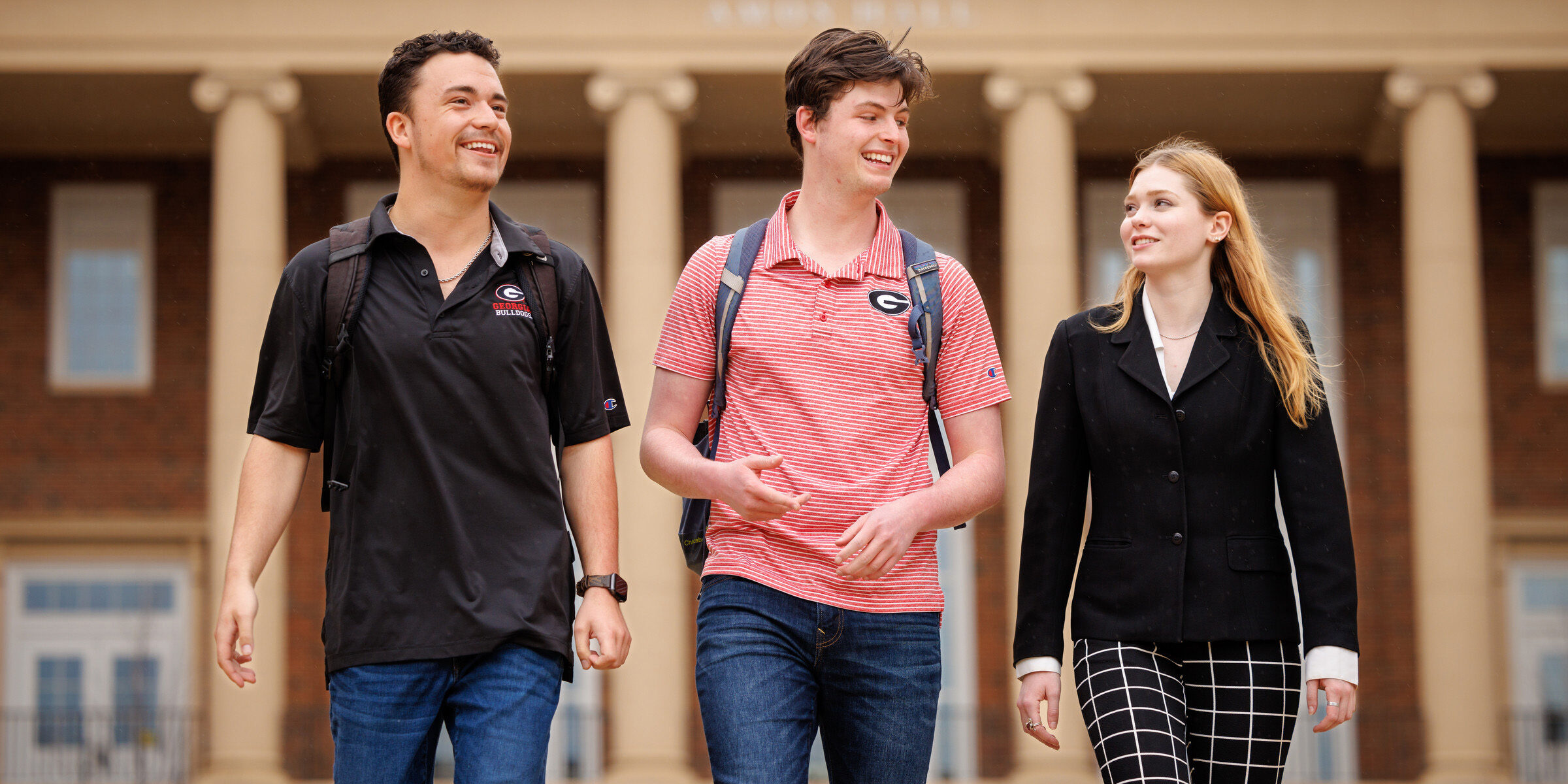 Students walk through outdoors.