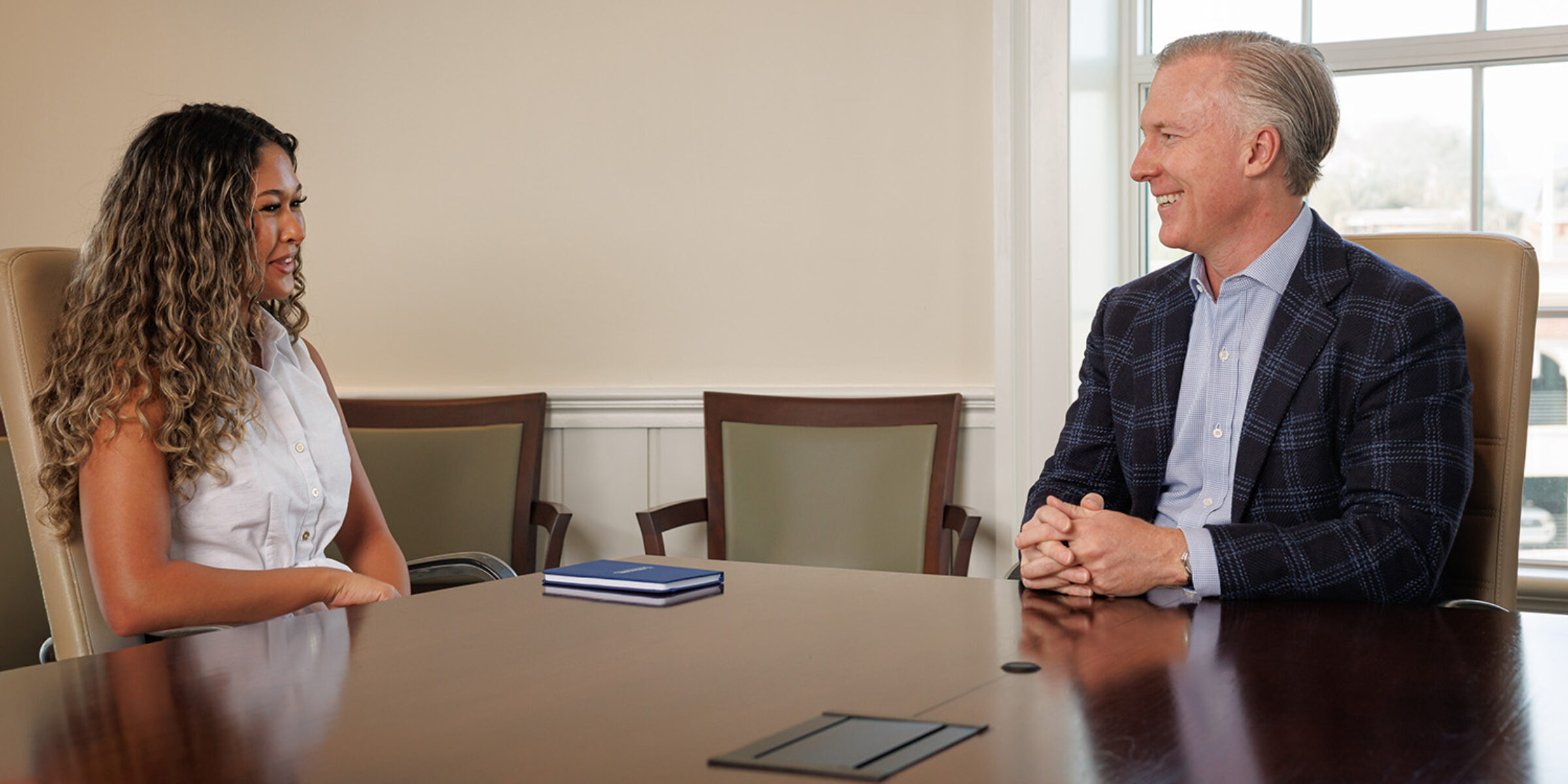 Terry College student Loren Upchurch talks with Wes Rogers, chairman and CEO of Landmark Properties.