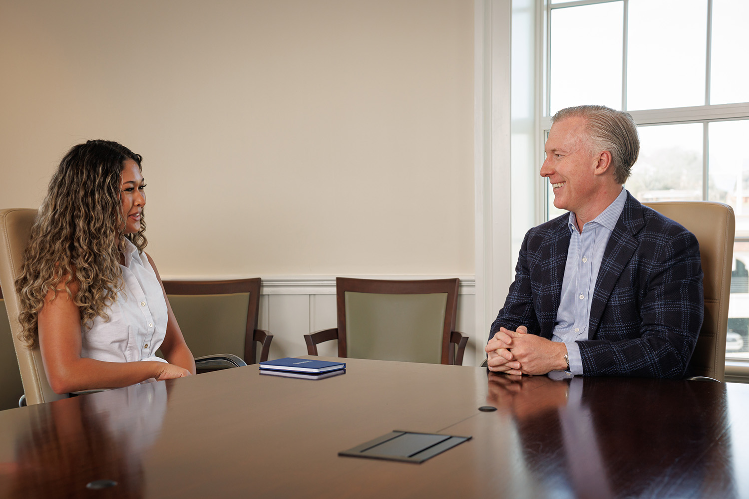 Terry College student Loren Upchurch talks with Wes Rogers, chairman and CEO of Landmark Properties.