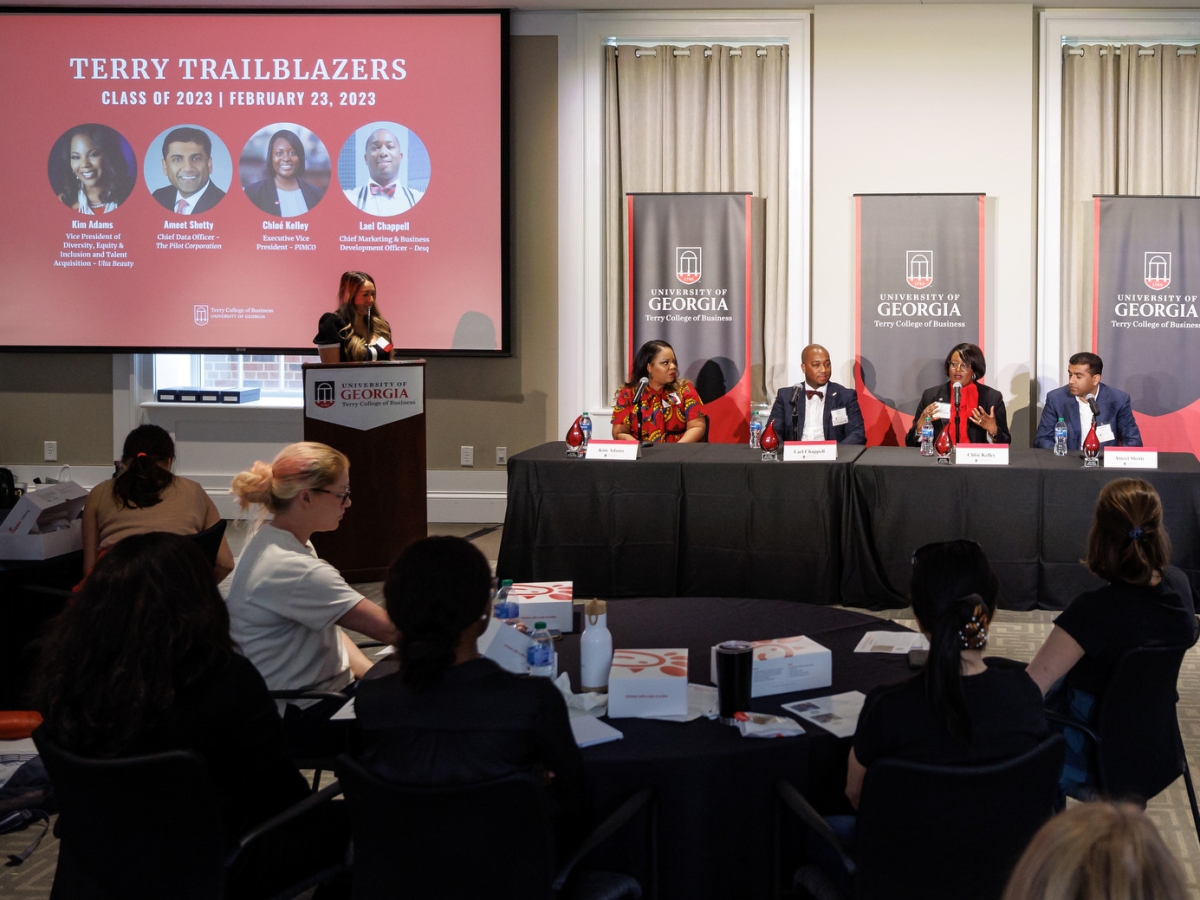 Trailblazers sitting a panel table in front of student audience