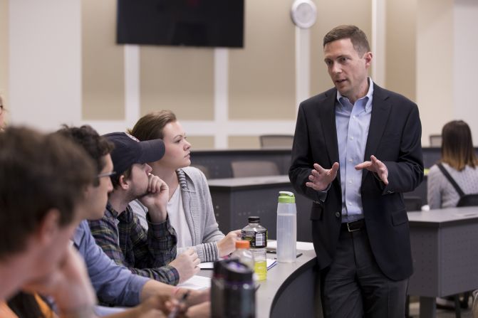 Alex Reed talks to his students during a lecture.