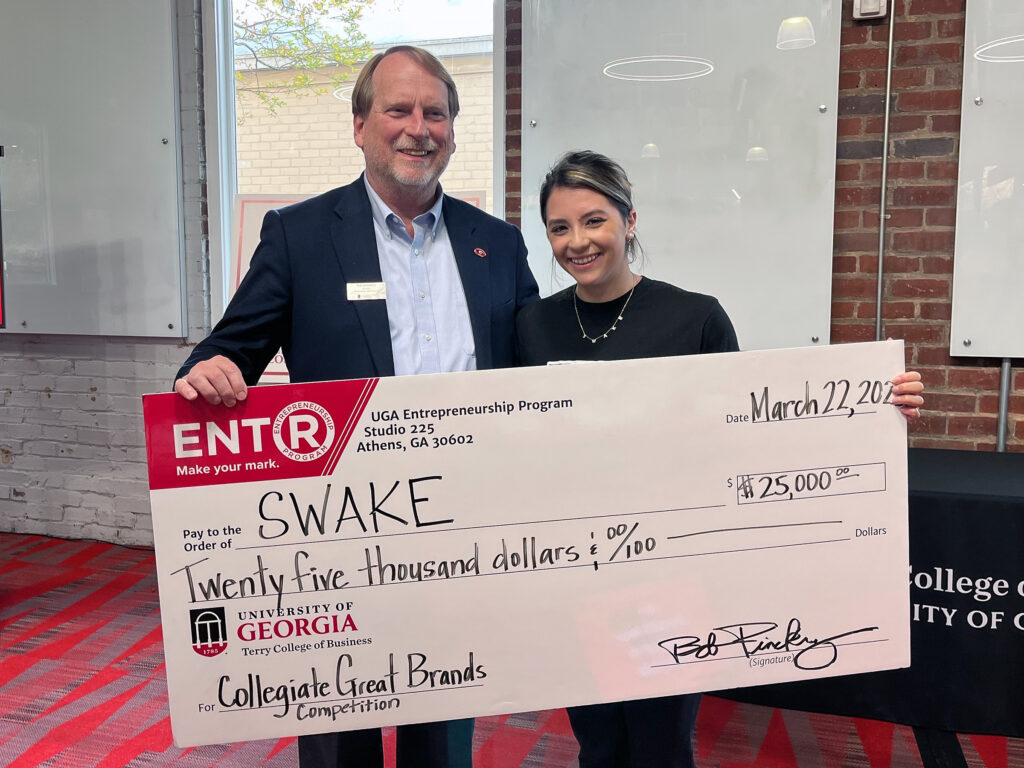 Bob Pinckney and Vanessa Sachs holding prize check