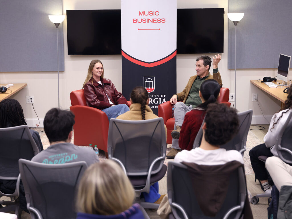 Sara Berman and David Barbe talk to students in a recording lab