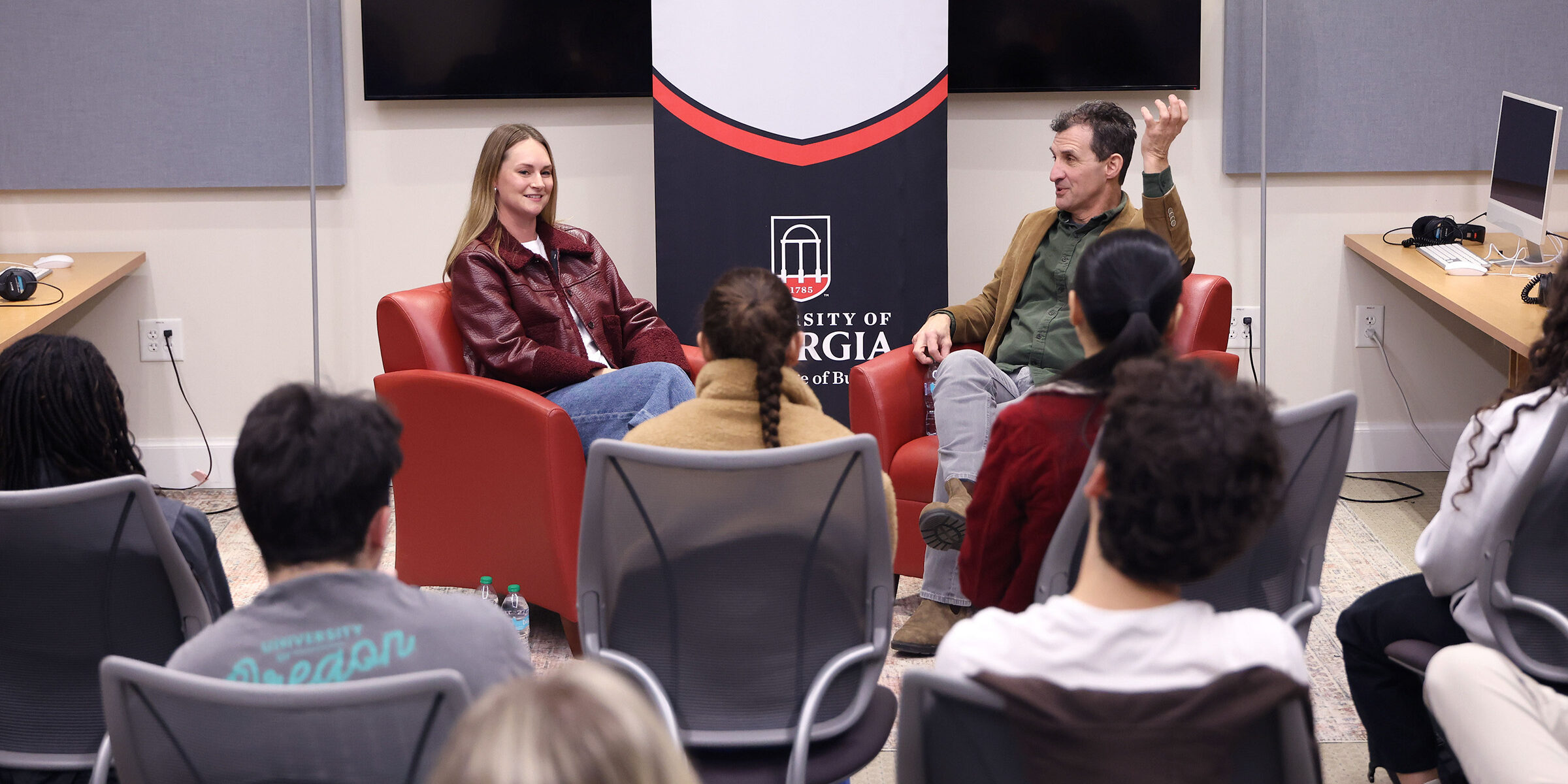 Sara Berman and David Barbe talk to students in a recording lab