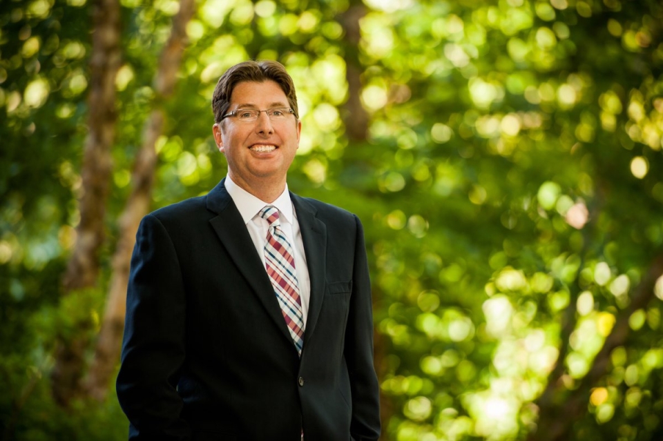 Scott Graffin portrait in front of greenery