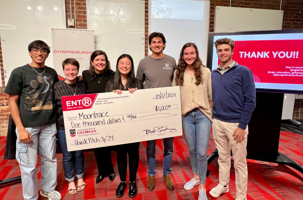 Moontrace winners group of students receiving award check