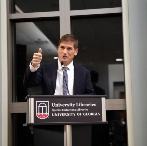 MIchael Bonds speaks from behind a UGA-branded podium