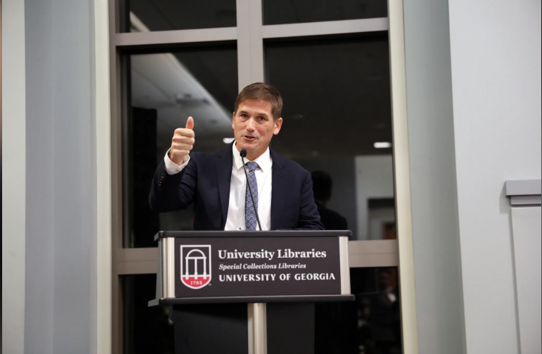 MIchael Bonds speaks from behind a UGA-branded podium