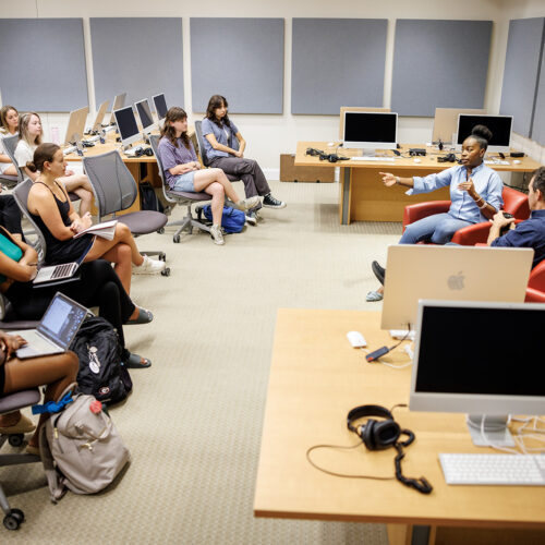 Attorney Shay Lawson speaks with Music Business Program Director David Barbee in the Terry music production classroom.