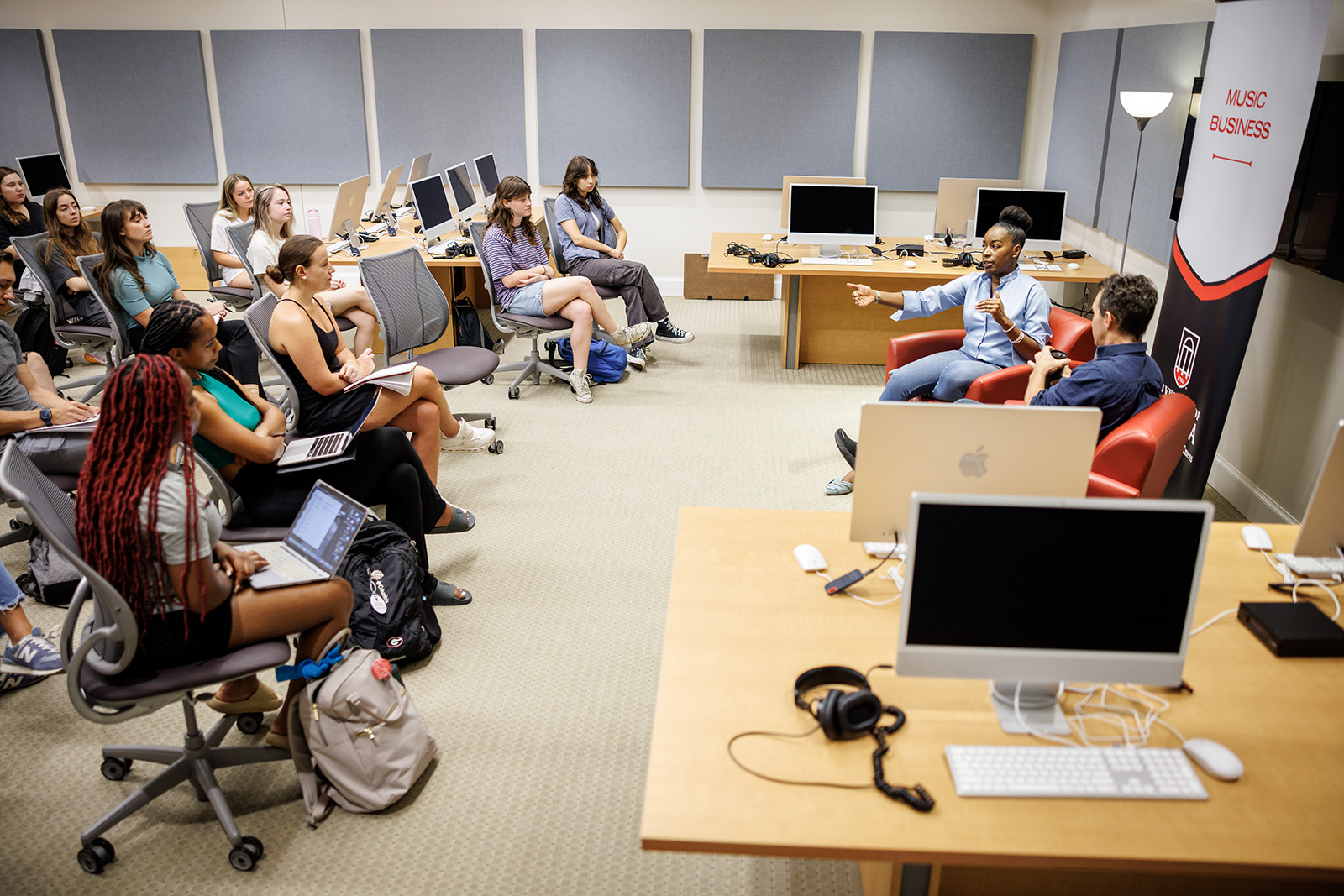 Attorney Shay Lawson speaks with Music Business Program Director David Barbee in the Terry music production classroom.