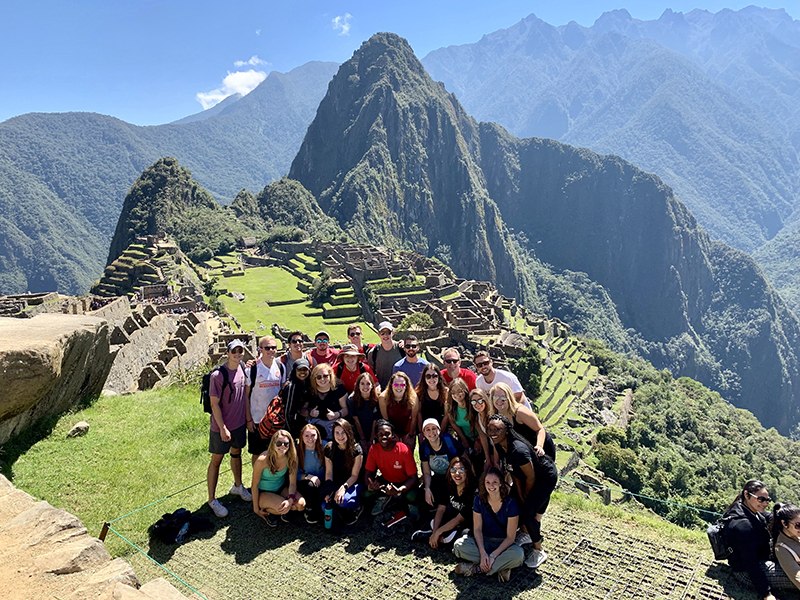 Terry College study abroad students pose at Machu Picchu in Peru.