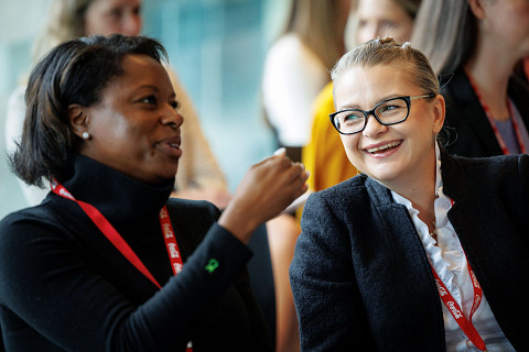 Two women talking at the Terry Professional Womens Conference