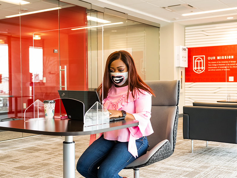 A Terry College Executive MBA student studies at the UGA Terry Executive Education Center in Buckhead.