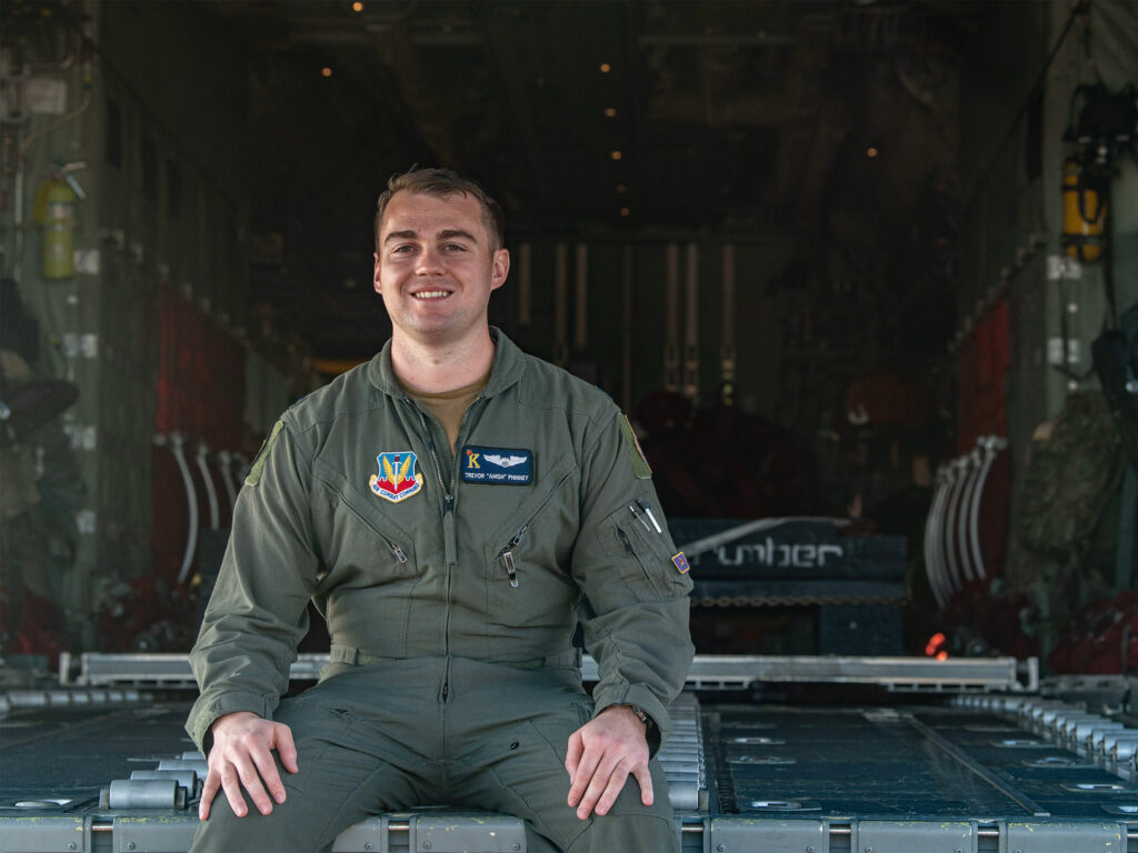 Air Force Capt. Trevor Phinney in cargo hold of a HC-130J Combat King II