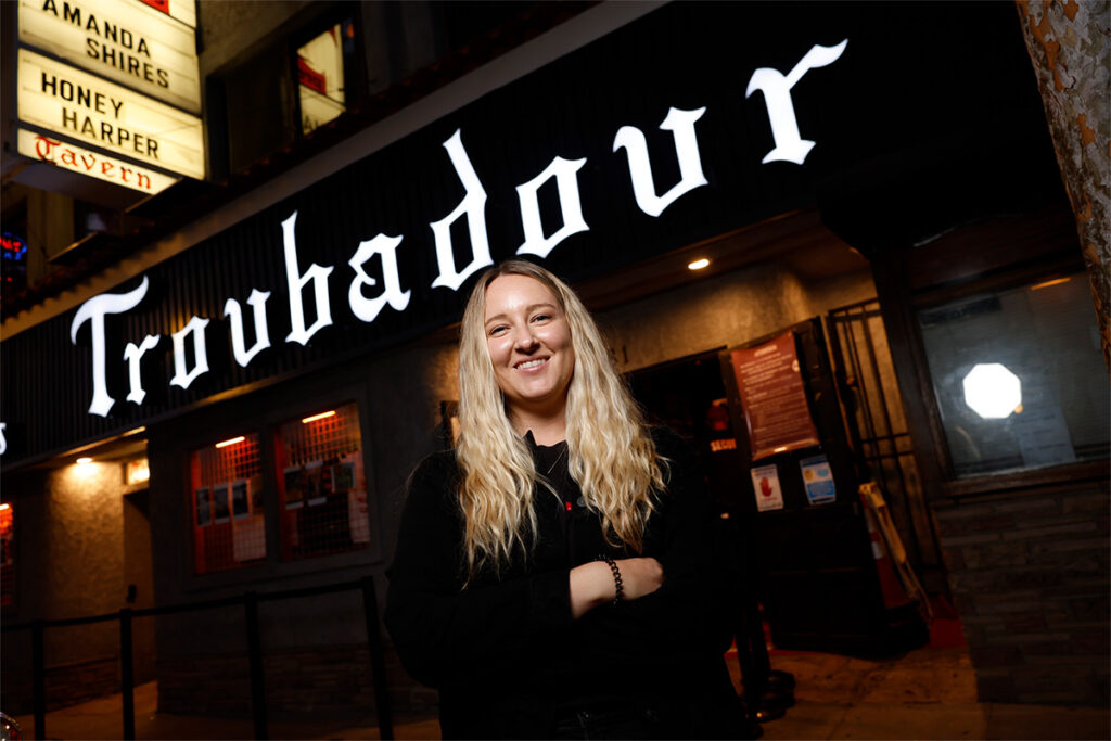 Jordann Anderson in front of the Troubadour