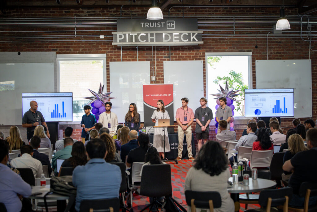 Students present their AI solutions to the crowd gathered at the immersive learning experience created and hosted by Truist. Students present their AI solutions to the crowd gathered at the immersive learning experience created and hosted by Truist.
