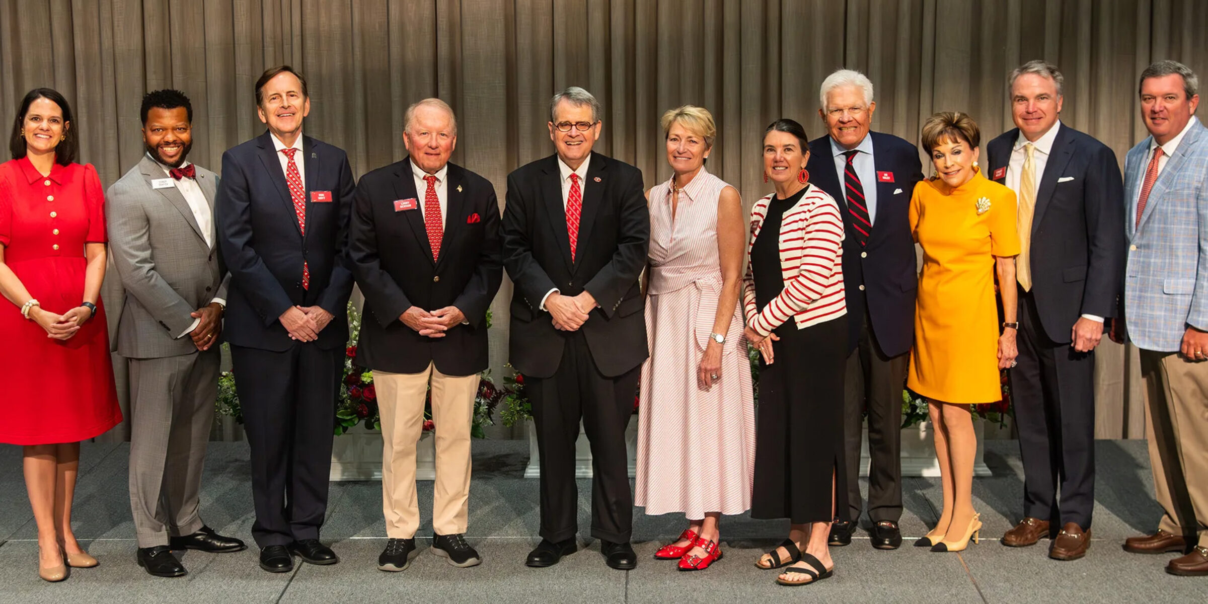 UGA leaders and Alumni Awards honorees, pictured from left to right: Jill Walton, vice president for development and alumni relations; Corey Dortch, alumni association president; Robert Hoyt; Larry Benson; UGA President Jere W. Morehead; Nancy Juneau; Nancy Harman, mother of Young Alumni Award recipient Brian Harman; Jim Nalley; Rene Nalley; Street Nalley; and Clay Nalley. (Photo by Justin Evans Photography)