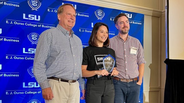 UGA Entrepreneurship director Bob Pinckney and Assistant Director Jim Flannery congratulate Vanessa Sachs.