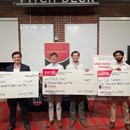 Winners of the 2026 Venture Prize Competition post with their large checks.