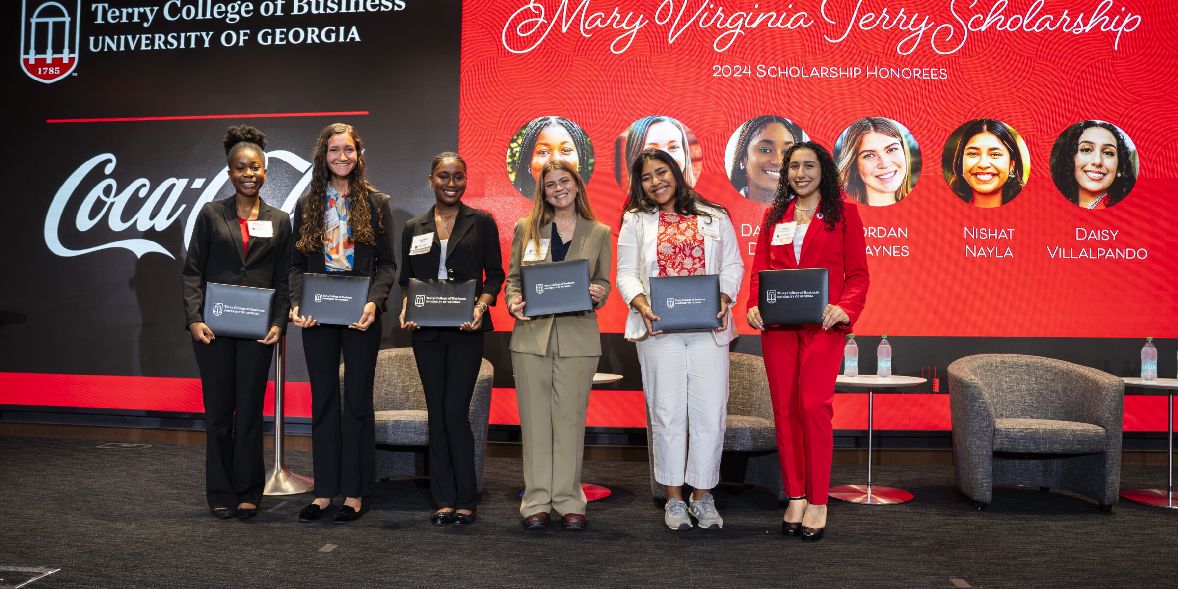 6 women posing with awards