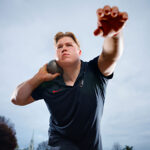 man preparing to launch shot put