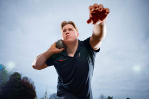 man preparing to launch shot put