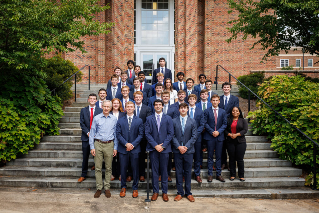 Arch Bond students with faculty mentor on steps of Correll Hall