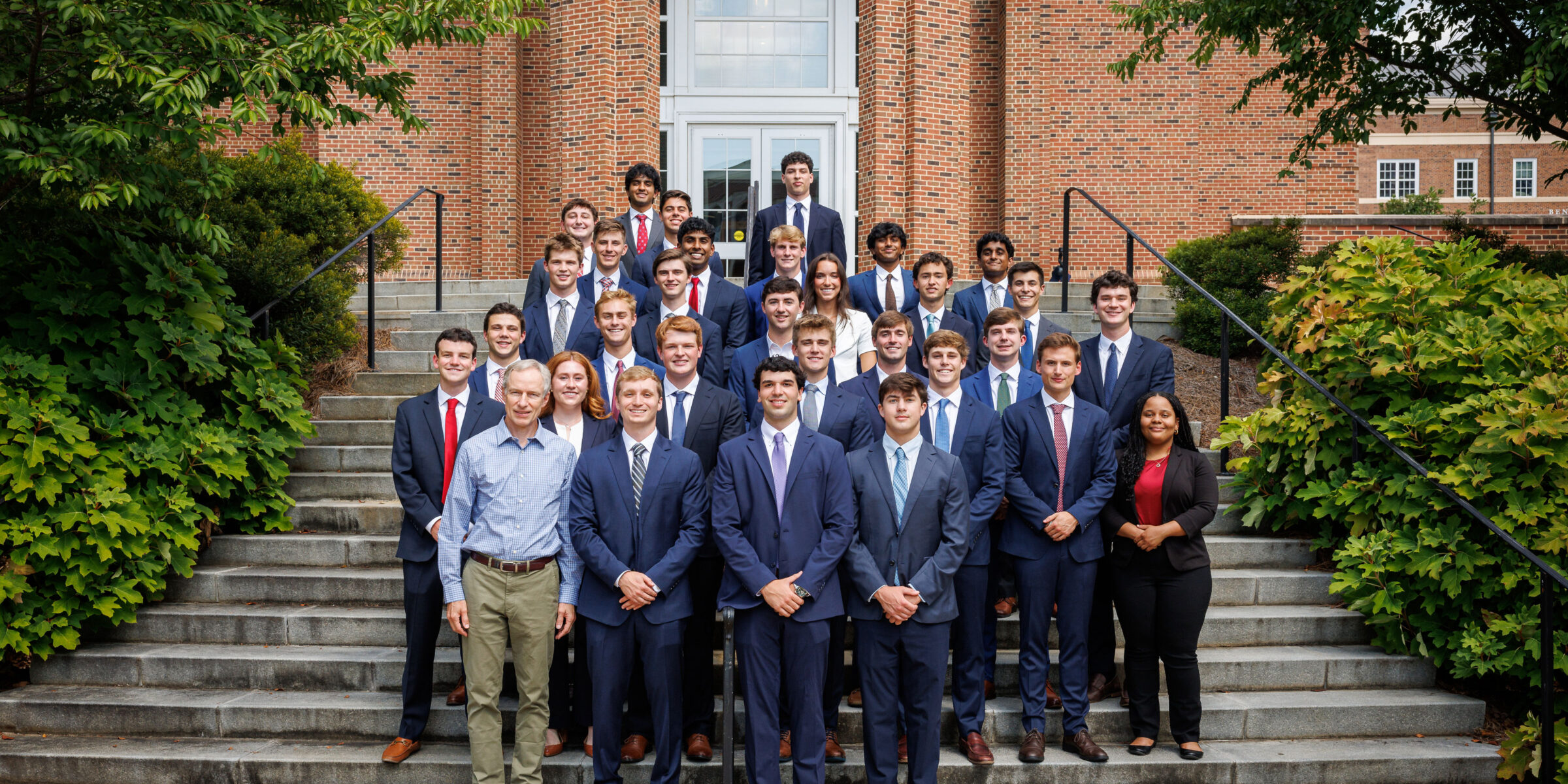 Arch Bond students with faculty mentor on steps of Correll Hall