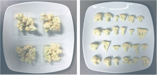 Cauliflower on plates, broken up into small pieces.