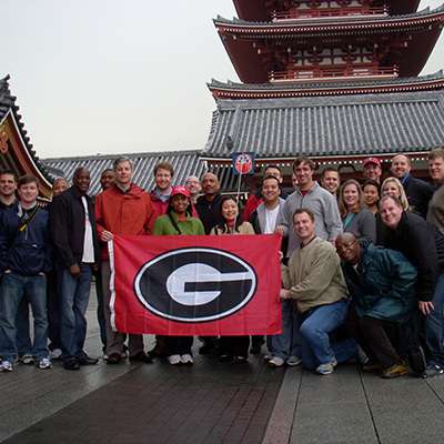 emba-global EMBA students pose with a Georgia flag