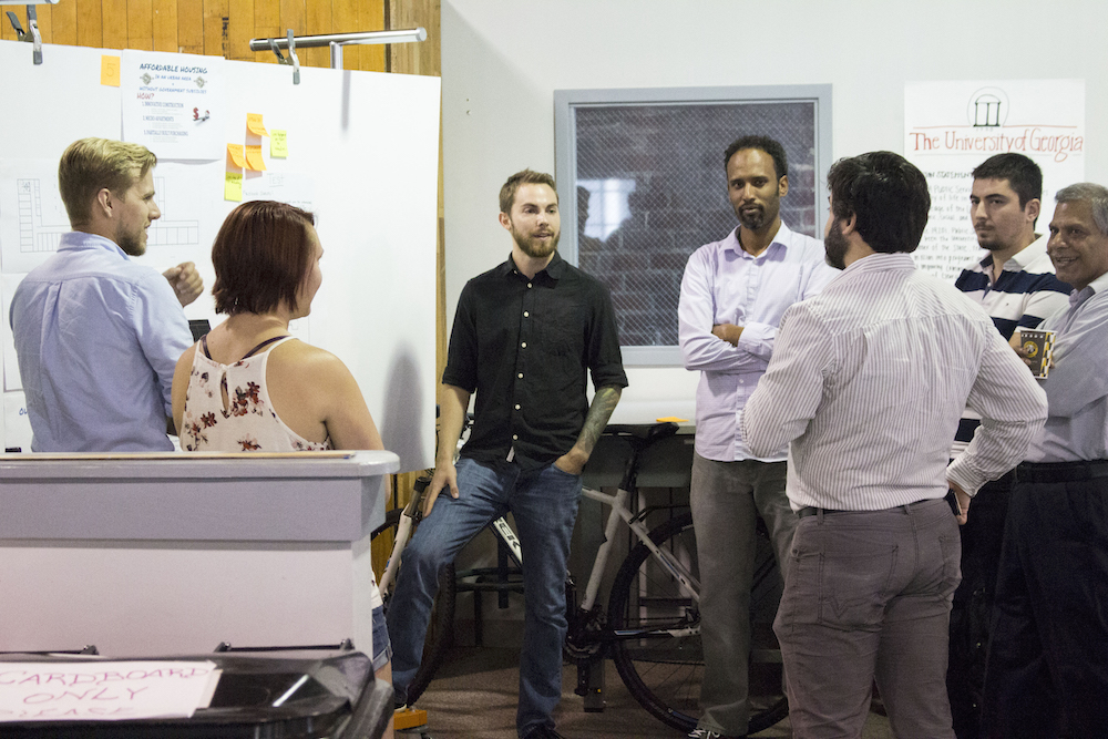 University of Georgia graduate students discuss their entrepreneurial projects during a Creative Design Thinking class at Broad Street Studio One in Athens last year.